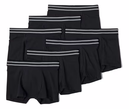 Pile de six boxers noirs avec des bandes blanches à la taille.
