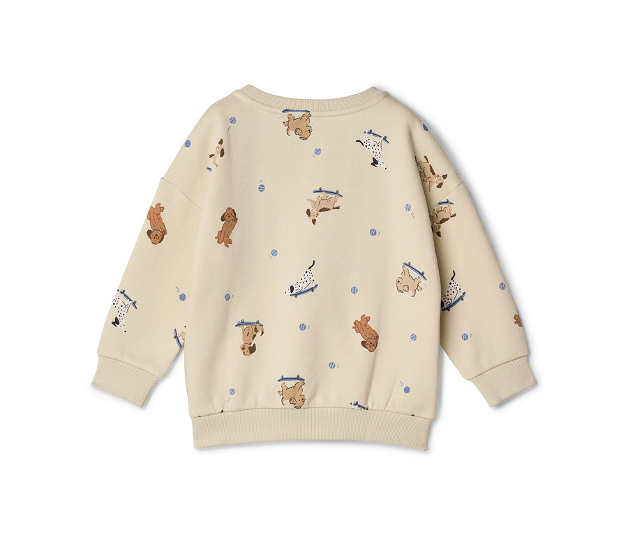 Sweat-shirt enfant beige avec un motif de chiens de dessin animé sur des skateboards bleus et de petits points bleus.