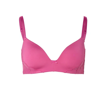 Un soutien-gorge rose avec de la dentelle sur les côtés et un petit nœud au centre.