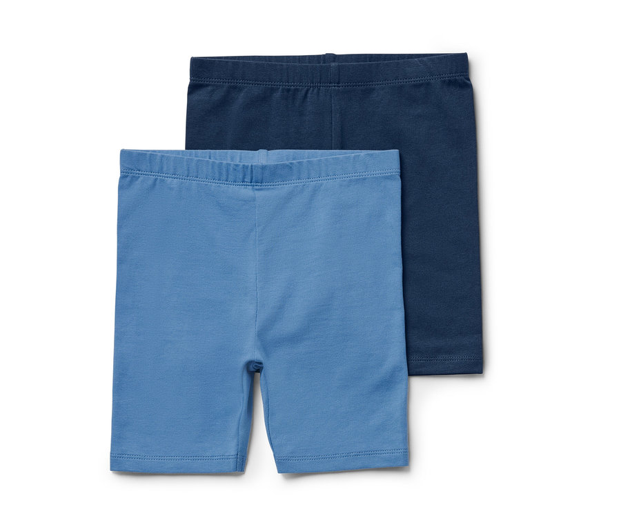 Deux leggings de cycliste bleus pour enfant.