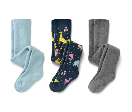 L'image montre trois collants thermiques pour enfant : une paire bleu clair, une paire bleu marine avec des motifs d'animaux et une paire grise.