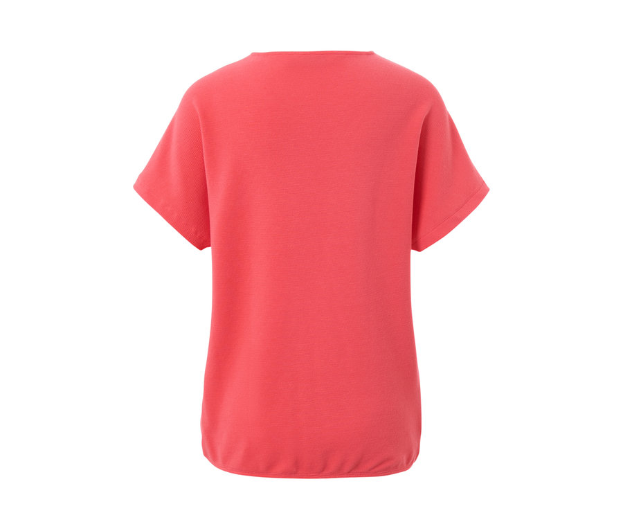 Vue arrière d'une blouse corail.