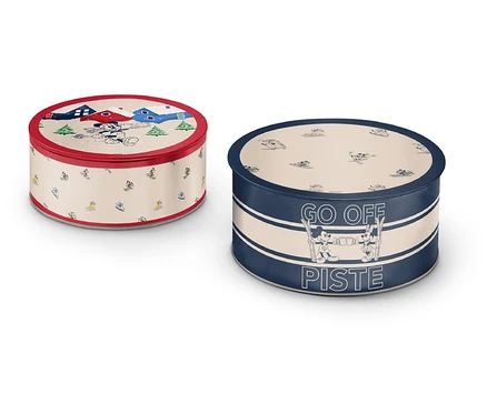 Deux boîtes rondes en métal avec différents motifs et couleurs.