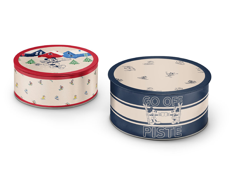 Deux boîtes rondes en métal avec différents motifs et couleurs.