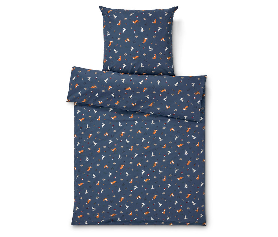 Literie avec motif de renards sur fond bleu.