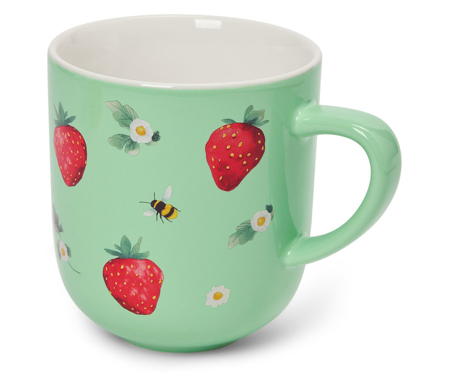 Tasse vert clair avec fraises et abeilles.