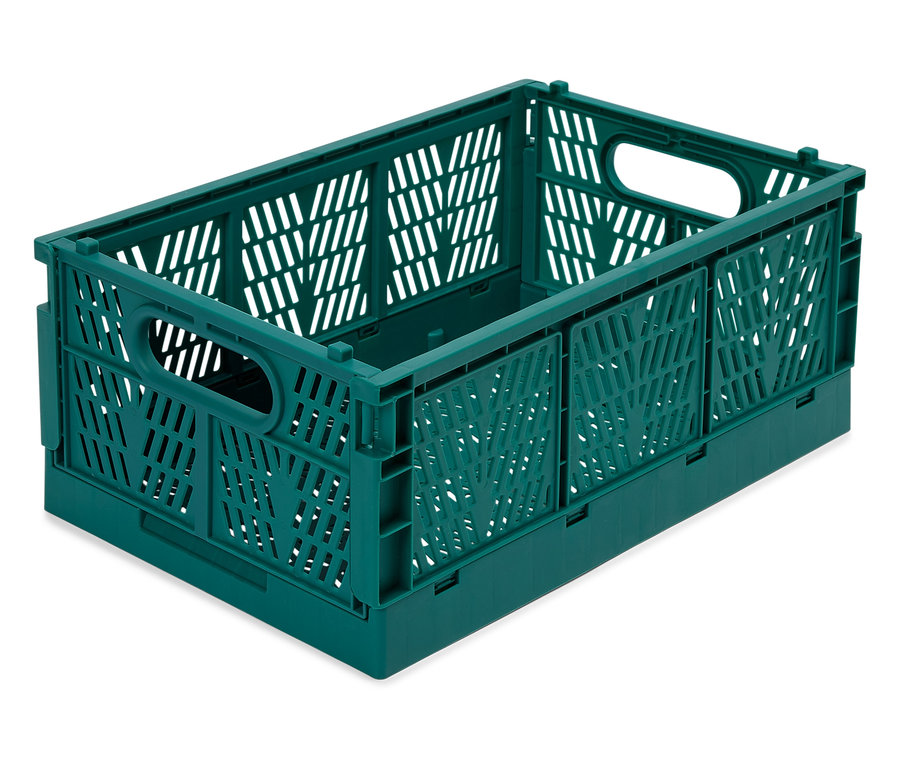 Une caisse en plastique verte pliable sur un fond blanc.