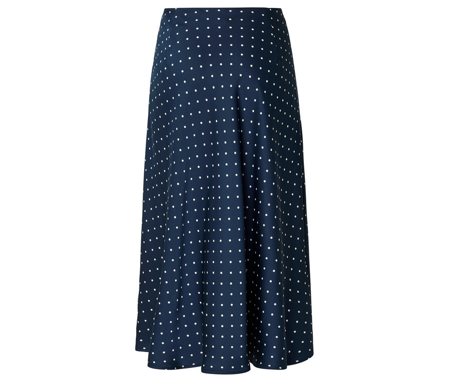 Jupe bleu marine à pois blancs, coupe évasée.