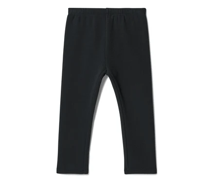 Legging noir avec taille élastique, posé à plat.