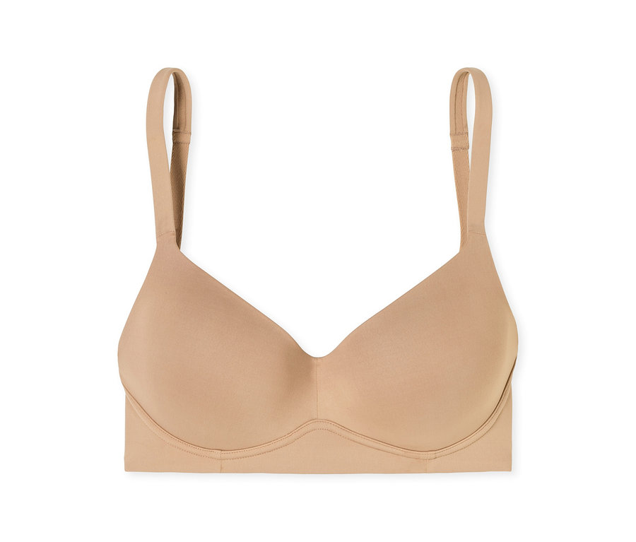 Un soutien-gorge beige sans coutures avec des bonnets moulés et des bretelles réglables.
