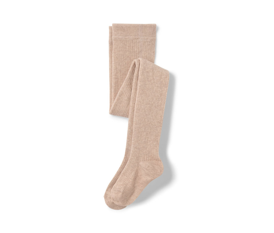 Collants beige pour enfant avec laine RWS sur fond blanc.