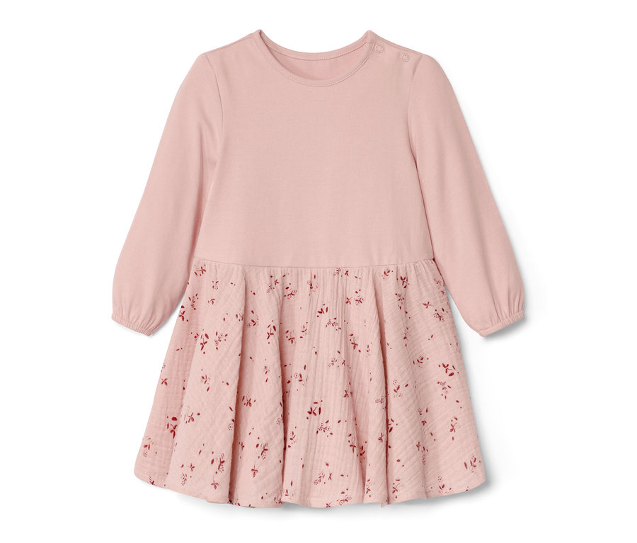 Robe tissée rose pour bébé avec des manches longues et un motif floral sur la jupe.