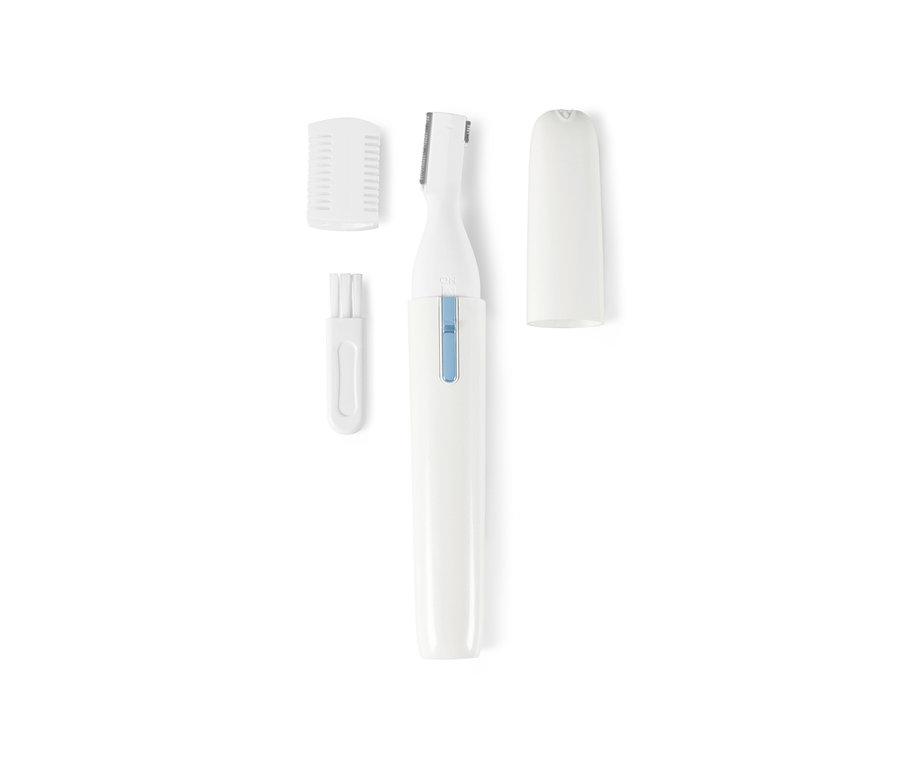 Un rasoir cosmétique électrique blanc avec des accessoires et une brosse de nettoyage.