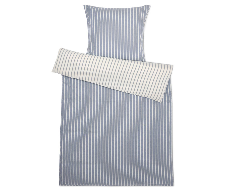 Linge de lit rayé avec oreiller.
