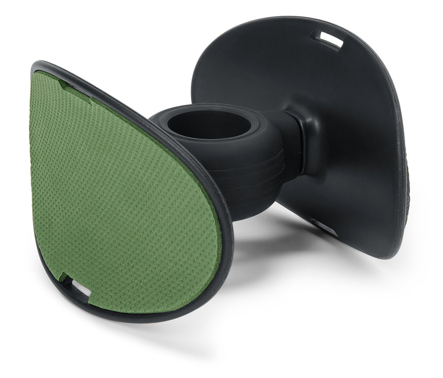 Détail d'un support noir avec un coussinet vert.