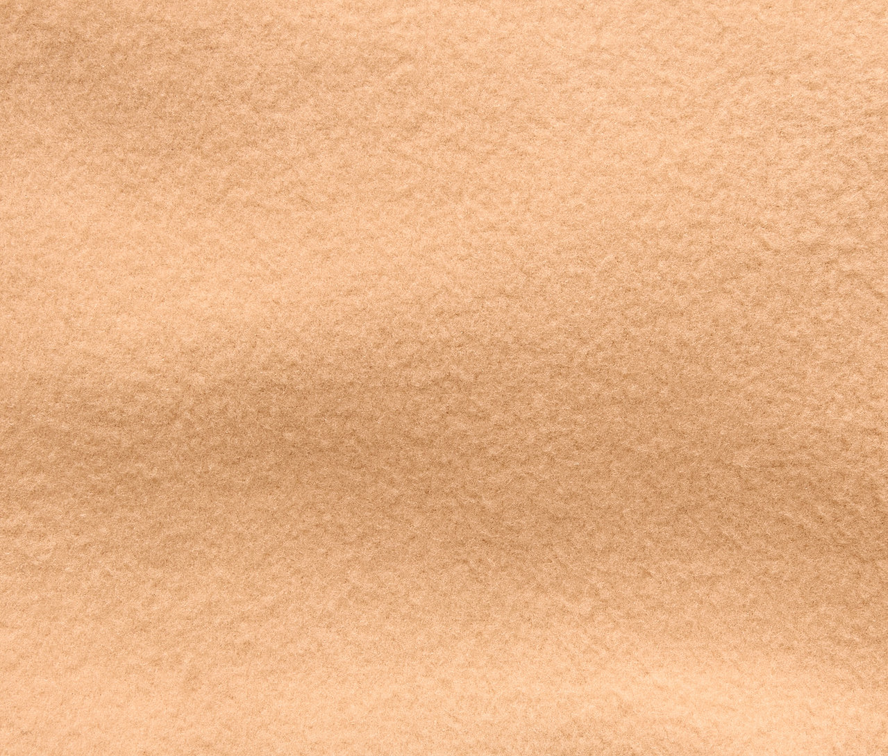 Gros plan sur la texture d'un tissu beige.