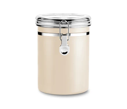 Une boîte à arômes beige tendre avec un couvercle argenté se trouve sur un fond blanc.