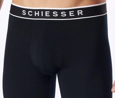 Caleçon boxer noir avec ceinture noire, bande blanche et logo SCHIESSER blanc.