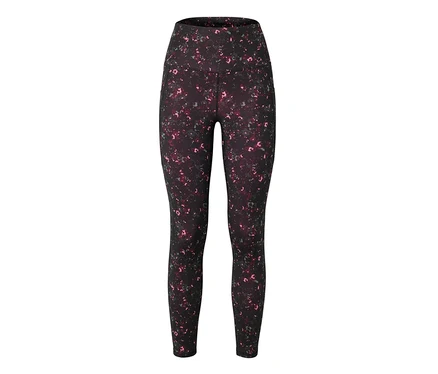 On voit un legging noir à taille haute avec un motif de taches roses et grises.