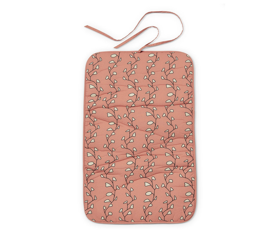 Nappe de repassage pliable avec motif floral sur fond framboise.