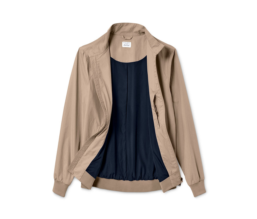 Blouson beige ouvert avec une doublure bleu foncé.