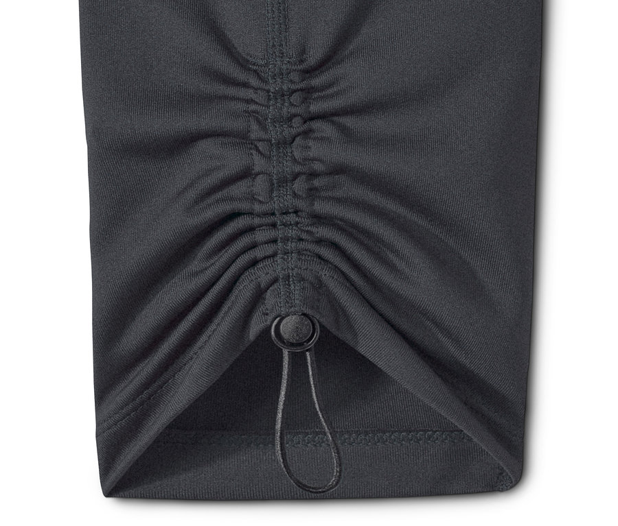 Détail d'un legging de sport 7/8 gris avec cordon de serrage.