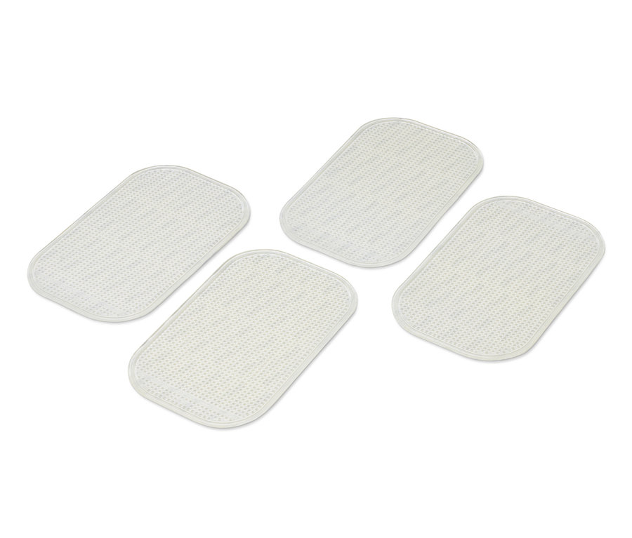 Quatre patins antidérapants de tapis.