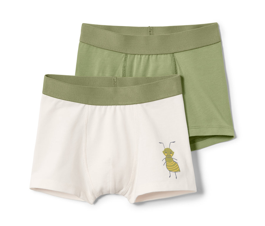 Deux boxers pour tout-petit, un vert clair et un crème avec un motif de fourmi.