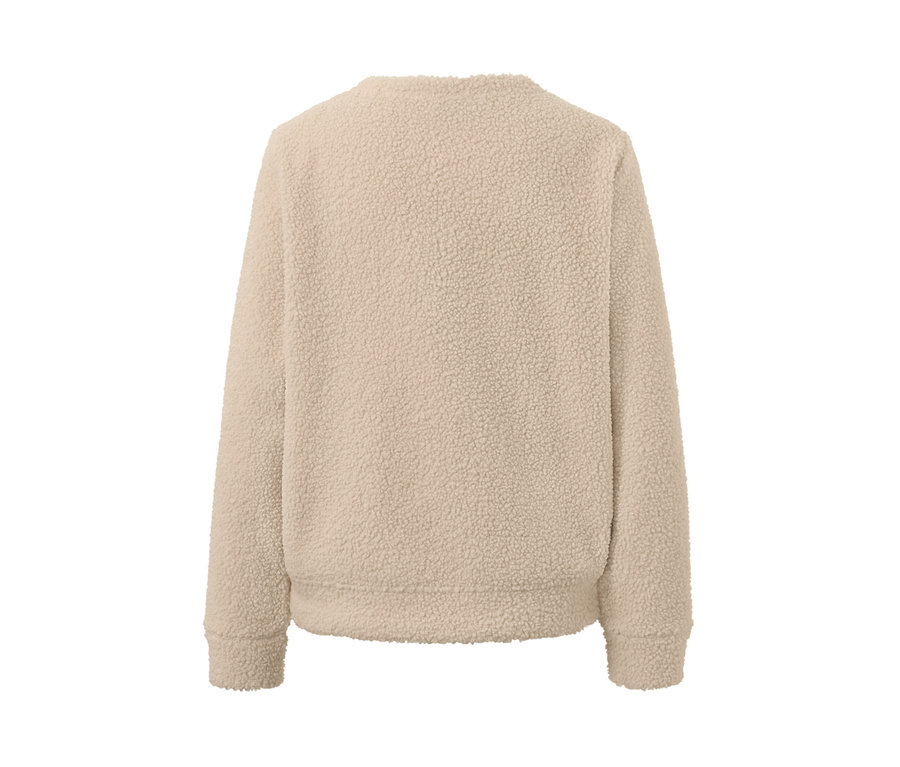 Vue détaillée d'un sweatshirt moelleux couleur crème.