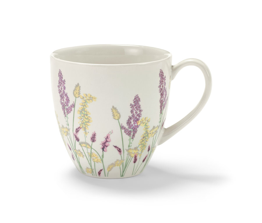 Tasse blanche avec motif floral.