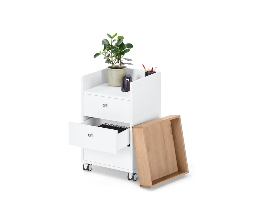 Caisson à roulettes blanc avec tiroirs dont un est ouvert, un tiroir en chêne est posé à côté, une plante en pot est posée sur le dessus.