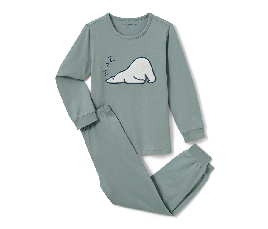 Un pyjama vert pour enfant avec un ours polaire endormi.
