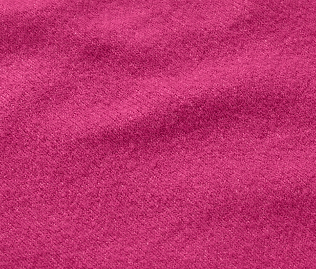 Gros plan sur une texture de tissu de couleur fuchsia.