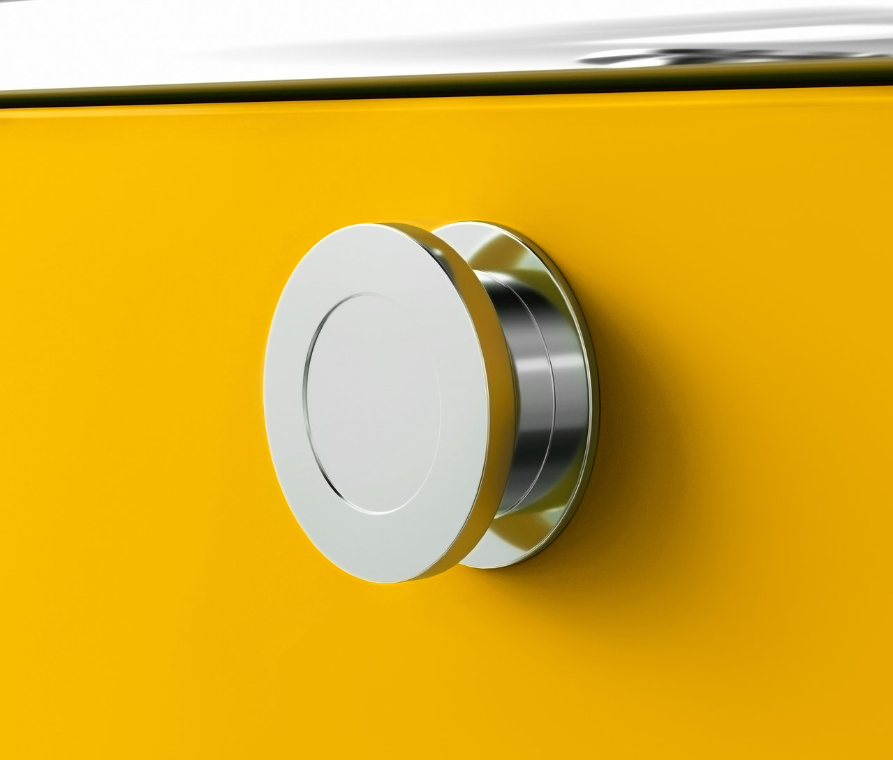 Détail du caisson à roulettes « CN3 » jaune avec 3 tiroirs et poignée ronde argentée.