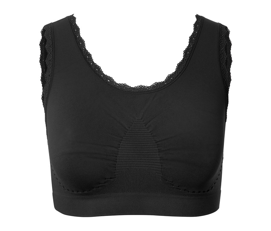 Soutien-gorge de sport noir avec dentelle sur fond blanc.