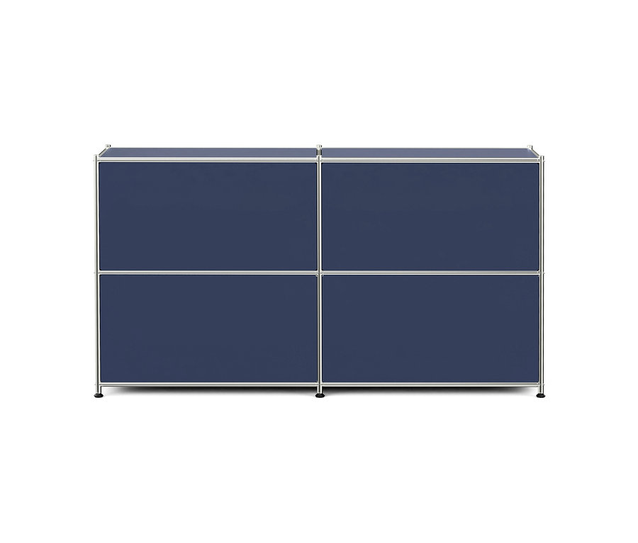 Meuble modulaire bleu foncé à quatre compartiments avec cadre argenté sur fond blanc.