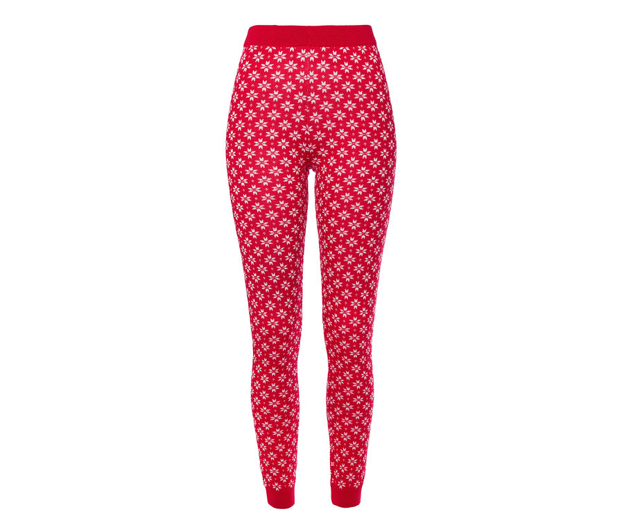 Legging en maille rouge avec motif de flocons de neige blancs.