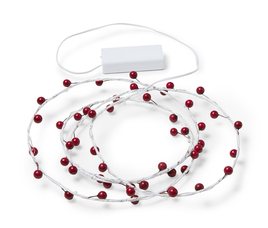 Branche décorative à LED avec des baies rouges.