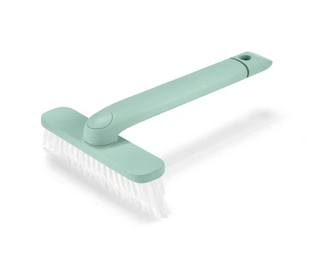 Un outil pour joints 4 en 1 vert avec des poils blancs sur un fond blanc.