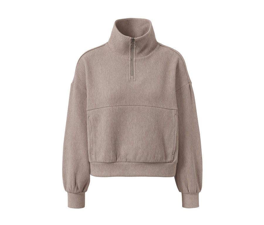 Pull molletonné beige avec fermeture éclair courte et texture côtelée.