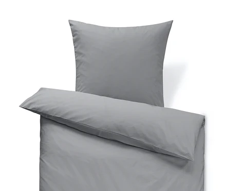 Parure de lit en percale grise de taille standard avec un oreiller sur le dessus.