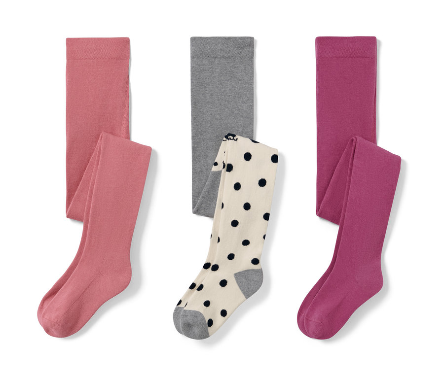 Trois collants pour enfant : rose, gris et rose baies.