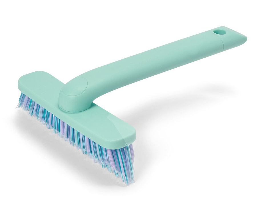 Brosse de nettoyage turquoise avec des poils bleus et violets.