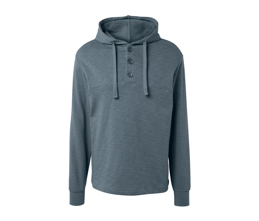 Un sweat à capuche gris avec des boutons.