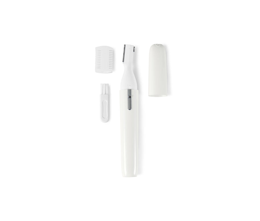 Un appareil de soin des sourcils blanc avec des accessoires sur un fond blanc.