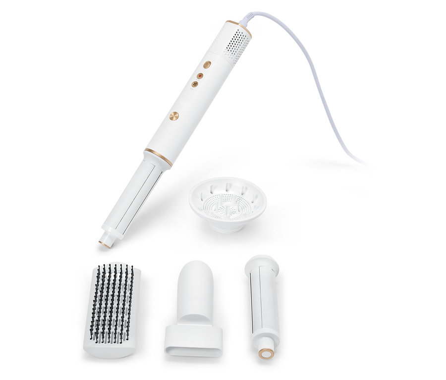 Un outil de coiffure multifonctionnel blanc avec différents accessoires sur un fond blanc.