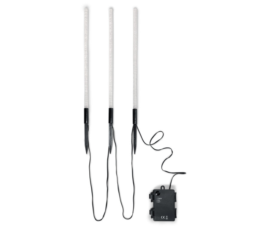 Trois lampes de jardin à LED avec câble noir et bloc de batterie sur fond blanc.