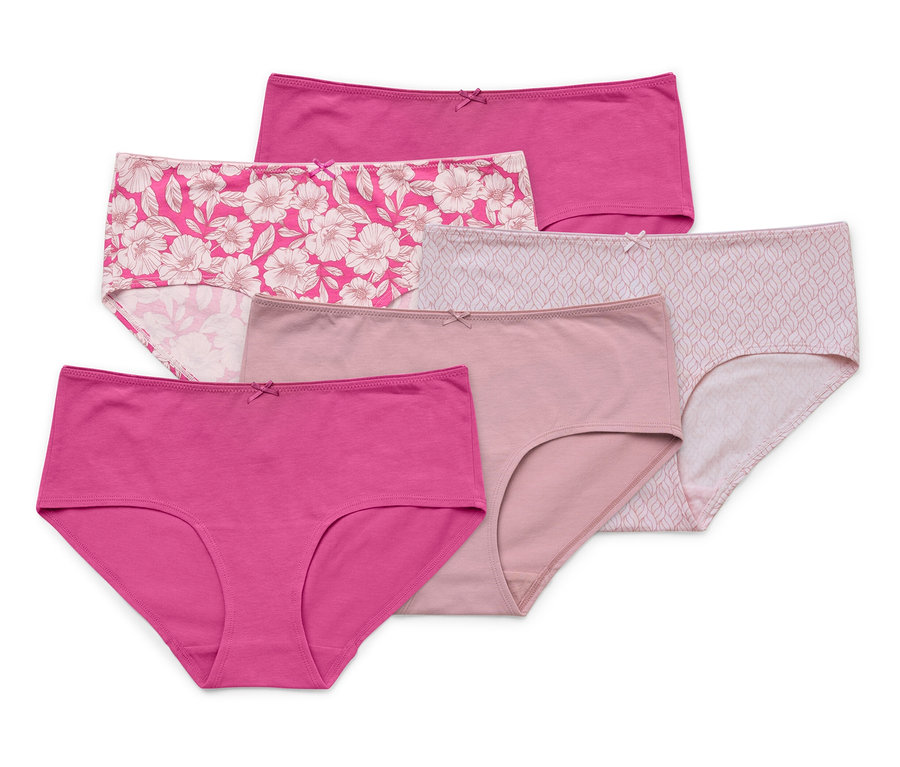 Gros plan sur cinq culottes dans différentes nuances de rose et avec différents motifs floraux empilées sur un fond blanc.