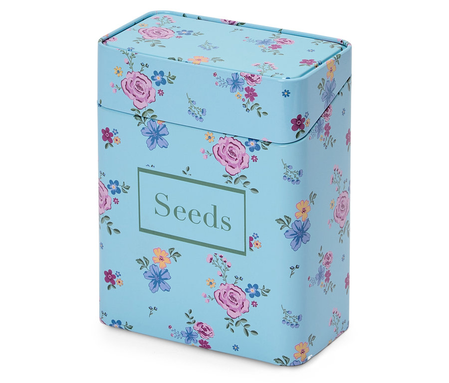 Une boîte bleu clair avec un motif floral et l'inscription "Seeds".
