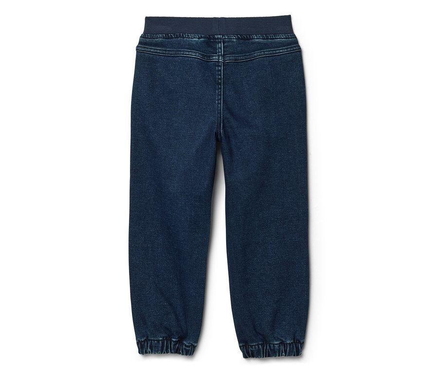Pantalon de jogging en jean bleu foncé vu de dos, avec taille et chevilles côtelées.
